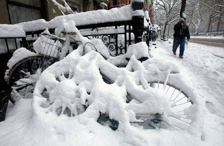 NEW YORK - MARCH 02: Bicycles are seen coverered in snow in the East Village March 2, 2009 in New York City. A large late winter snow storm hit the Northeast overnight dumping almost a foot of snow in some areas.